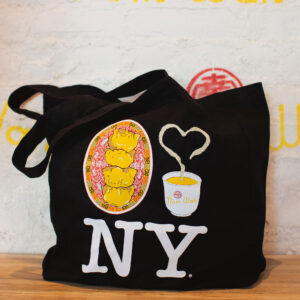 Up-close shot of the PiccoliNY x Nom Wah tote bag, featuring a riff on the "I Love NY" image